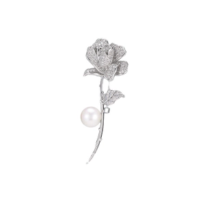 Exquisite silver rose brooch with cubic zirconia and a white pearl on white background