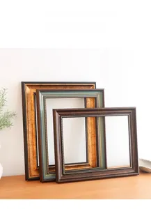 Close-up of European retro picture frames showing ornate gold edges and layered textures
