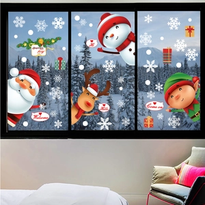 Festive Christmas window stickers with Santa, snowman and reindeer on glass pane