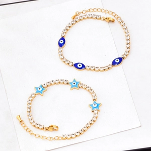 Gold chain bracelets with blue evil eye and star charms set in titanium steel