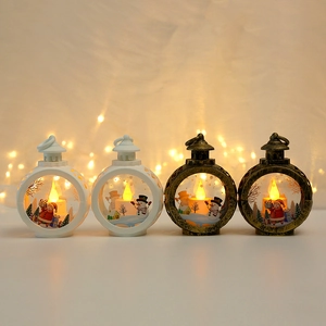 Glowing LED Christmas lanterns with Santa and snowman patterns for festive table decor