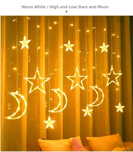Detail of warm white LED star and moon curtain fairy lights with high-low hanging pendants