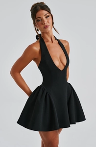 Detail view of black halter deep V-neck mini dress with waist slimming and flared skirt design