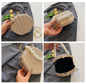 Detail view of beige shell clutch bag with pearl handle and golden chain strap in four angles