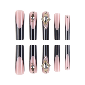 Long coffin French fake nails with black stripes, pink base and rhinestone accents