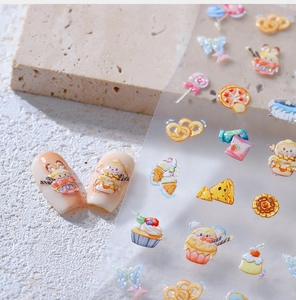 Macro view of 3D embossed nail stickers with cute cupcake and animal patterns on pink nails