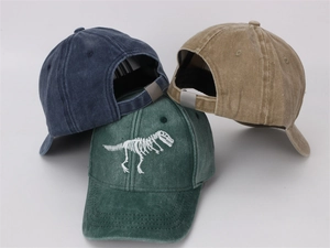 Three washed cotton kids baseball caps with dinosaur skeleton embroidery in assorted colors
