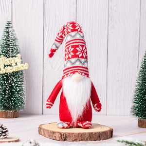 Handcrafted Christmas gnome plush doll with snowflake knit hat on wooden display base