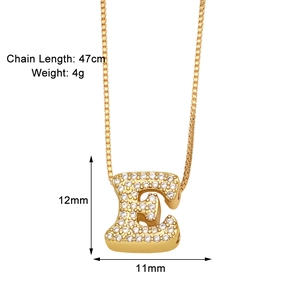 Detail view of gold letter E necklace pendant with cubic zirconia and exact dimensions