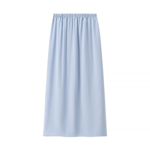 Detail view of light blue maxi skirt showing elastic waist and vertical fabric texture