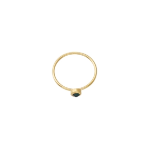 Detailed view of a minimalist gold band ring with a round green gemstone bezel setting