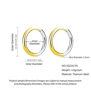 Two-tone titanium steel hoop earrings in gold and silver, 23mm diameter product dimensions