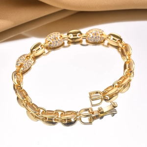 Detail of gold coffee bean link bracelet featuring pave-set cubic zirconia and snap clasp