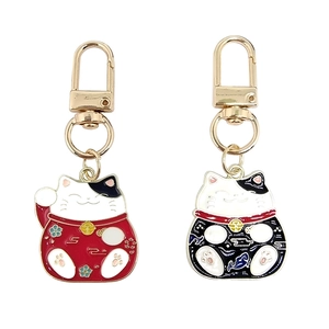 Lucky cat keychain set in red and black alloy with gold-tone metal clasp charms