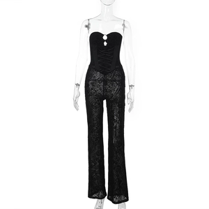 Detailed view of black lace jumpsuit featuring lace-up bodice and flared pants