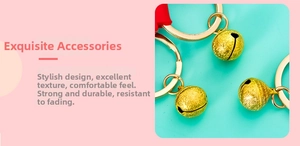 Detail of matte gold metal bell keychain with durable ring and textured finish