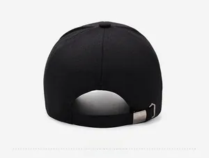 Close-up of black herringbone baseball cap with adjustable silver metal buckle back