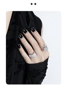 Detail of S925 silver irregular ring with flower pearl and textured band on model