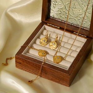 18K gold plated jewelry set with sun and moon relief pendants and inset crystals