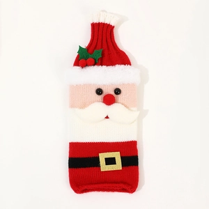 Knitted Santa wine bottle cover with red hat and white beard for Christmas table decor