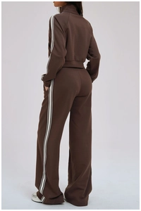Rear view of brown athletic set featuring side stripes on loose pants and a long sleeve top