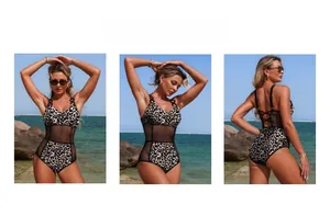 Detail of leopard print one-piece swimsuit featuring black mesh panels and lace-up back