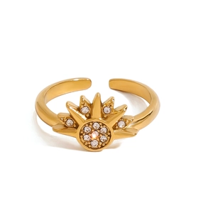 Golden stainless steel open ring with sun-shaped radiant design and white zircons