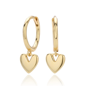 Detailed close-up of polished gold heart dangle hoop earrings on white background