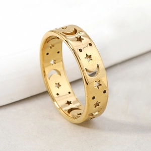 Golden stainless steel band ring with hollowed out star and moon celestial patterns