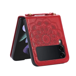 Detail of red leather phone case for Samsung Z Flip with embossed mandala and hand strap