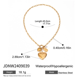 Detail showing 'I love you' engraving on golden heart locket with product specifications