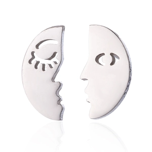 Macro view of minimalist hollow face stud earrings with polished silver metal finish