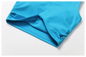 Detail view of sky blue yoga vest with side ruching and double-needle hem stitching