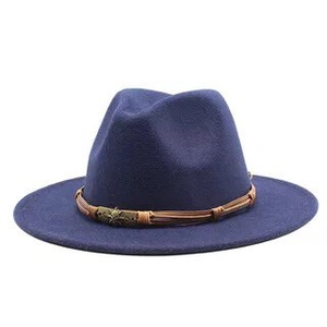 Detail of navy blue wool fedora with brown braided leather band and vintage metal buckle