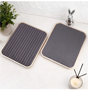 Detail of gray velvet jewelry trays with golden metal frames for rings and earrings