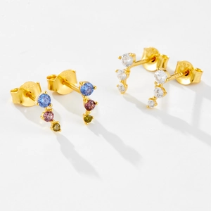 Macro shot of S925 sterling silver gold earrings with colorful zircon stones