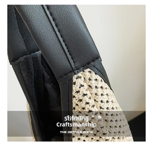 Detailed close-up of woven straw texture and premium black leather stitching on the bag