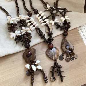 Bohemian coconut shell and wood bead necklace with heart, flower, and teardrop pendants
