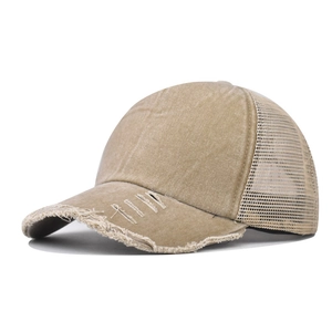 Close-up of distressed khaki washed cotton baseball cap with mesh trucker back detailing