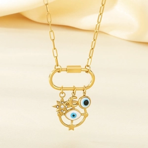 Golden paperclip chain necklace featuring star moon and blue evil eye charms pendant