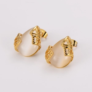 Elegant gold hollow earrings set with teardrop opal stones on a clean white background