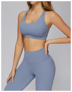 Detail of Morandi blue yoga set showing the racerback bra and high-waist compression leggings