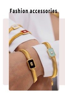 Detail of gold snake chain bracelet featuring colorful enamel and glass stone inlay