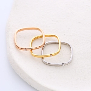Three-piece set of square stainless steel rings in rose gold, gold, and silver finishes