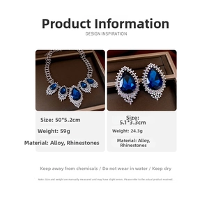Detail view of drop pendant necklace and earrings set with dimensions and blue crystals