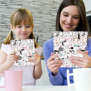 Detail of tablet covers featuring cute cartoon cat patterns held by mother and daughter