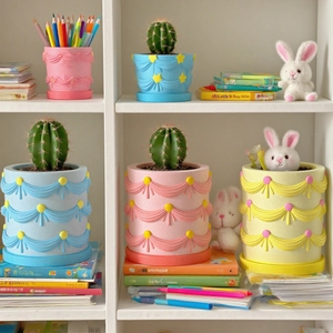 Pastel relief curtain flower pot and pen holder resin molds displayed on a shelf