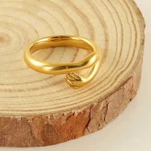 Polished 18k gold-plated stainless steel ring featuring a unique hugging hands design