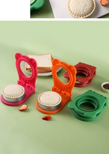 Detailed top view of four colorful bear-shaped sandwich crust cutters and sealers set