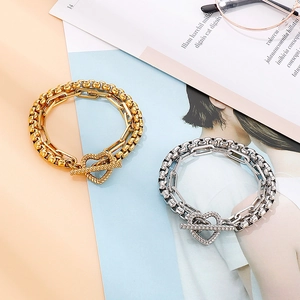 Double-layered stainless steel heart toggle clasp bracelet in gold and silver finish